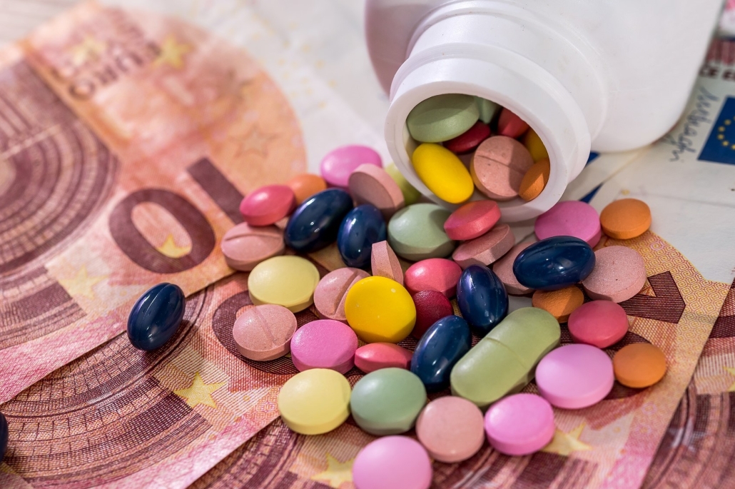Pharmaceutical conception with colorful drugs on euro notes
