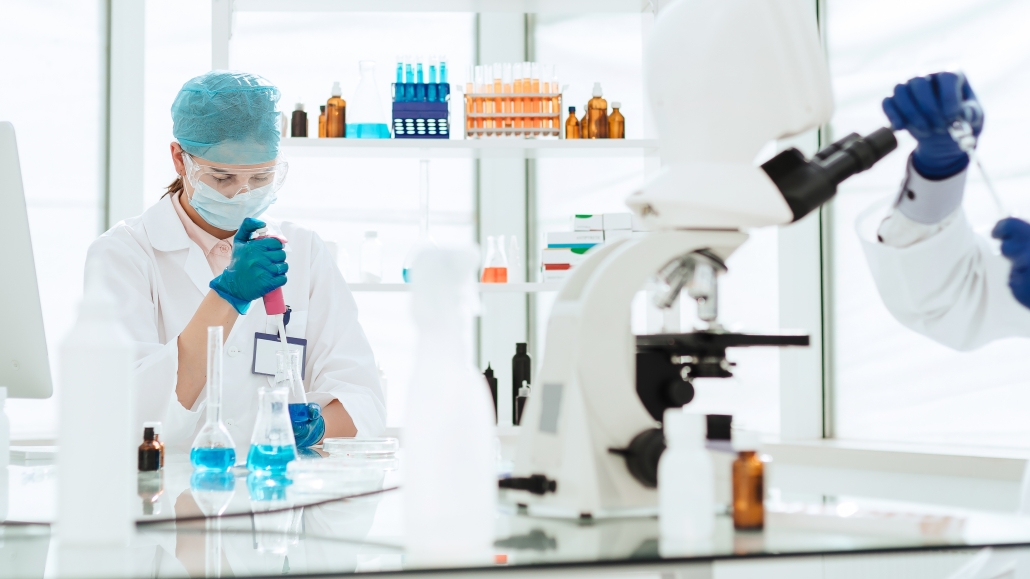 close up. a group of scientists are testing new drugs.